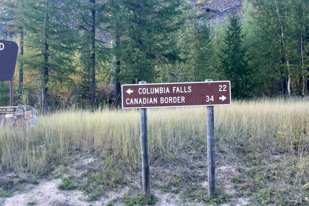Sign for Columbia Falls and the Canadian Border